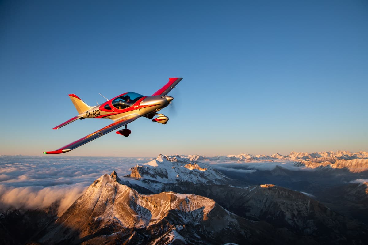 Bristell B23 over the Alps under a clear sky