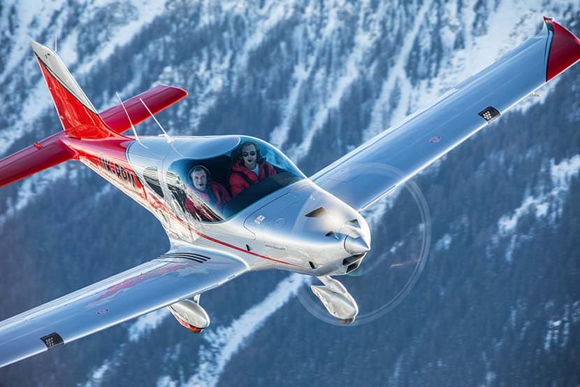 Bristell B23 Turbo over snow-covered alpine peaks