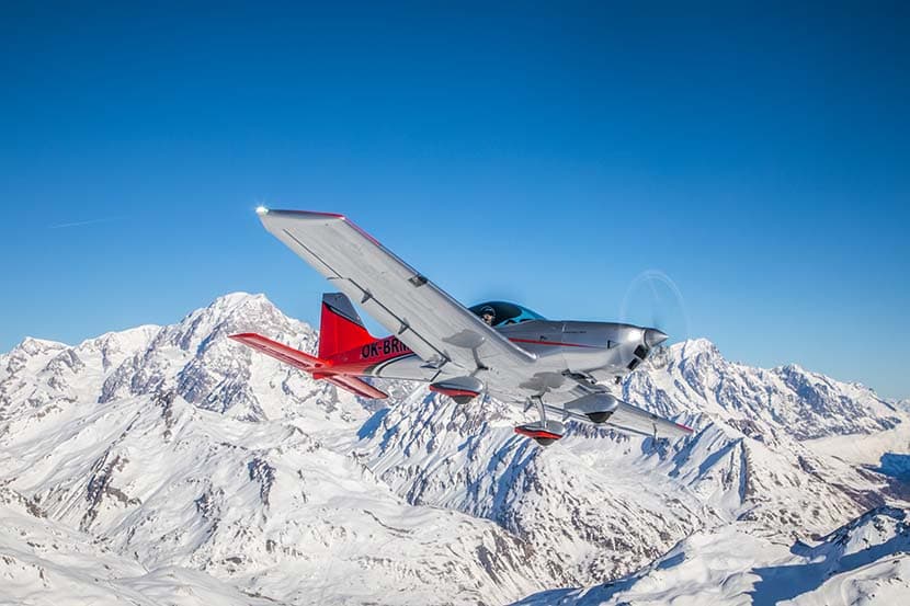 Bristell B23 Turbo banking over alpine terrain
