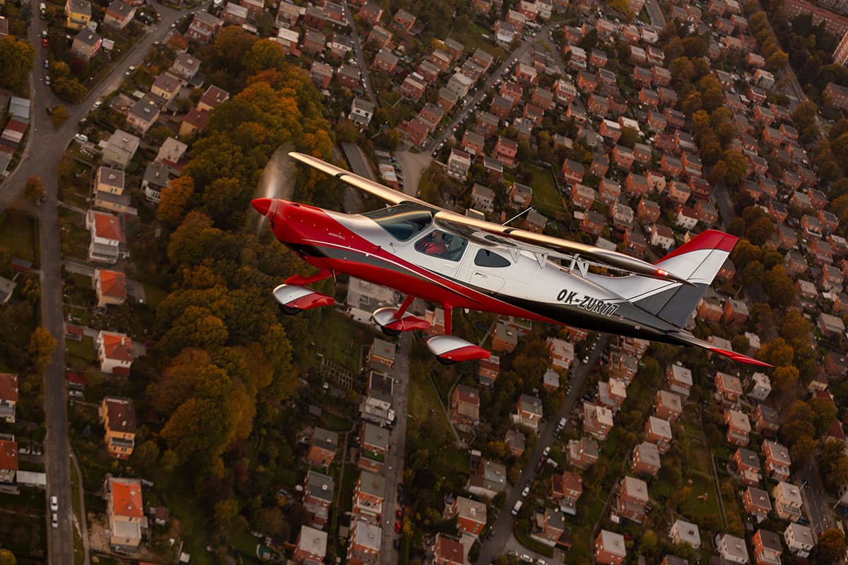 Top-down view of the Bristell B8 over a residential area