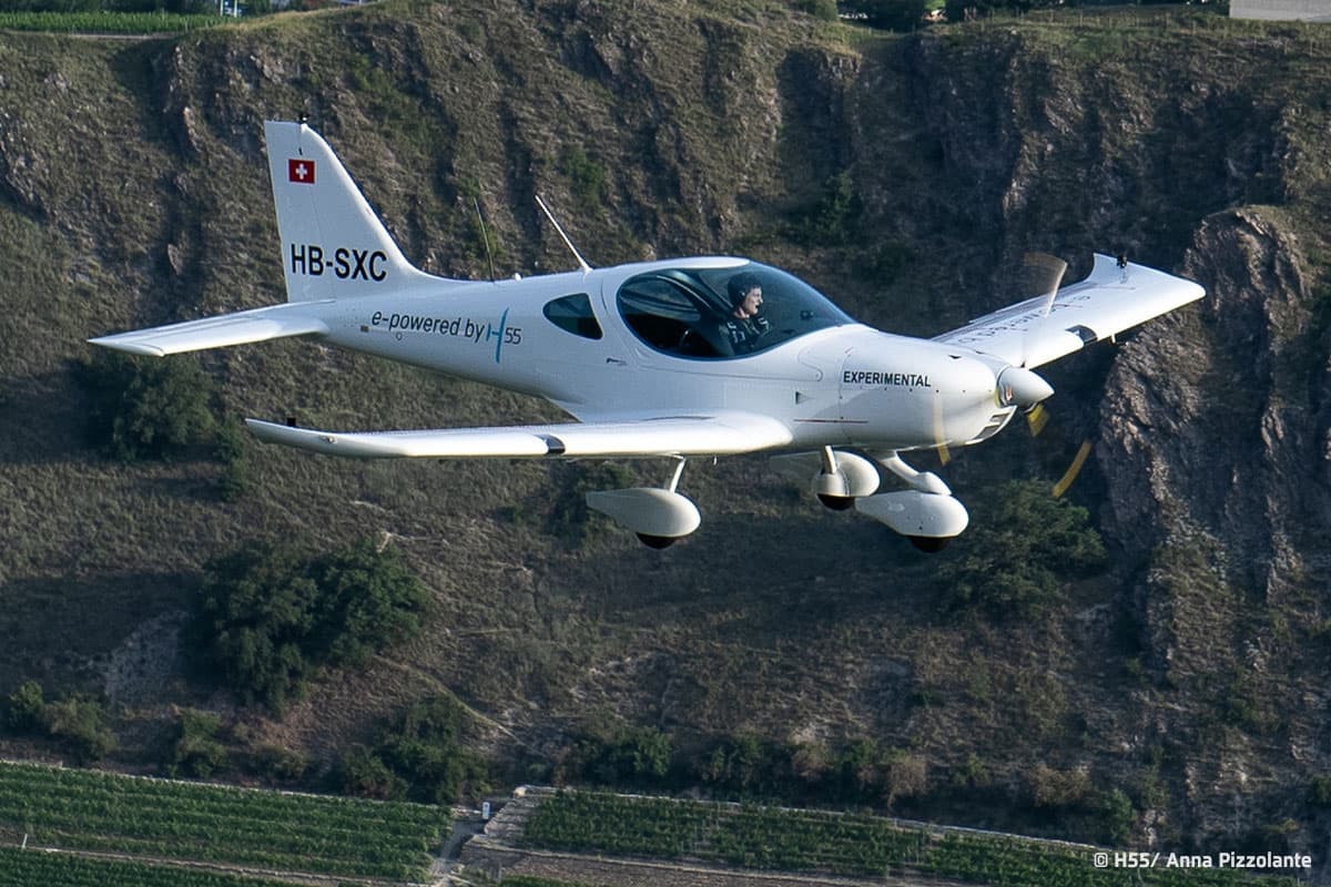 Bristell Energic flying quietly over an alpine valley