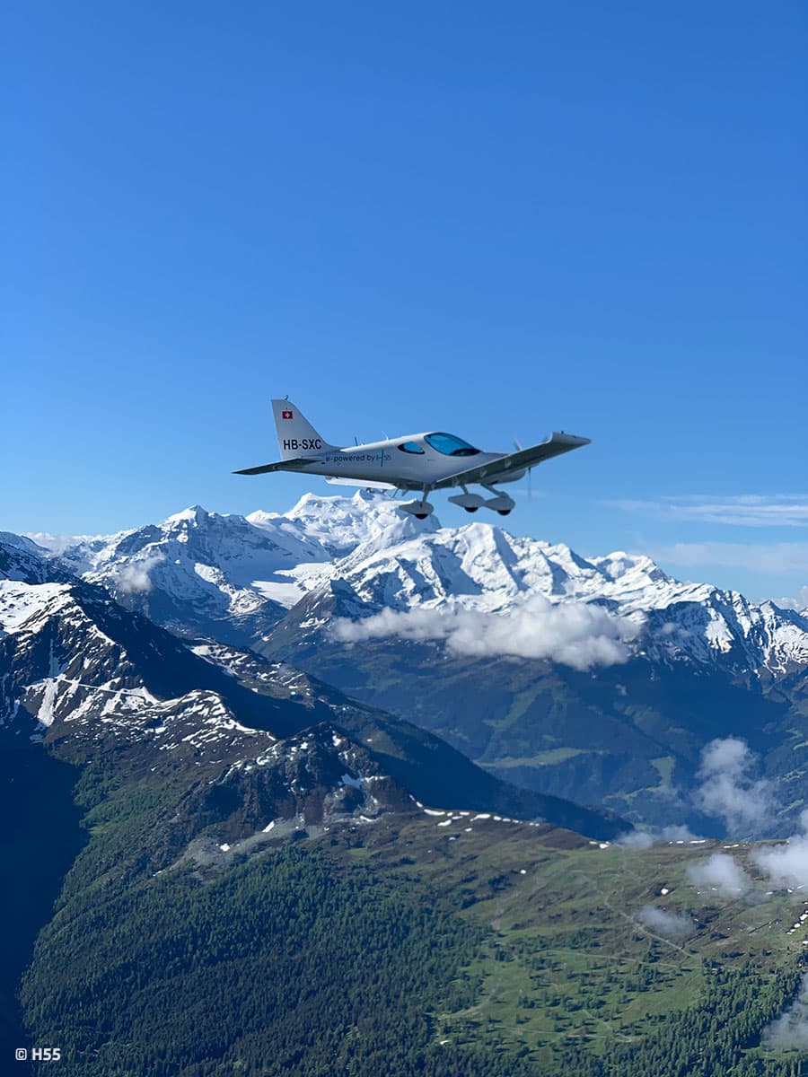 Bristell Energic above snow-covered Alps under a clear sky