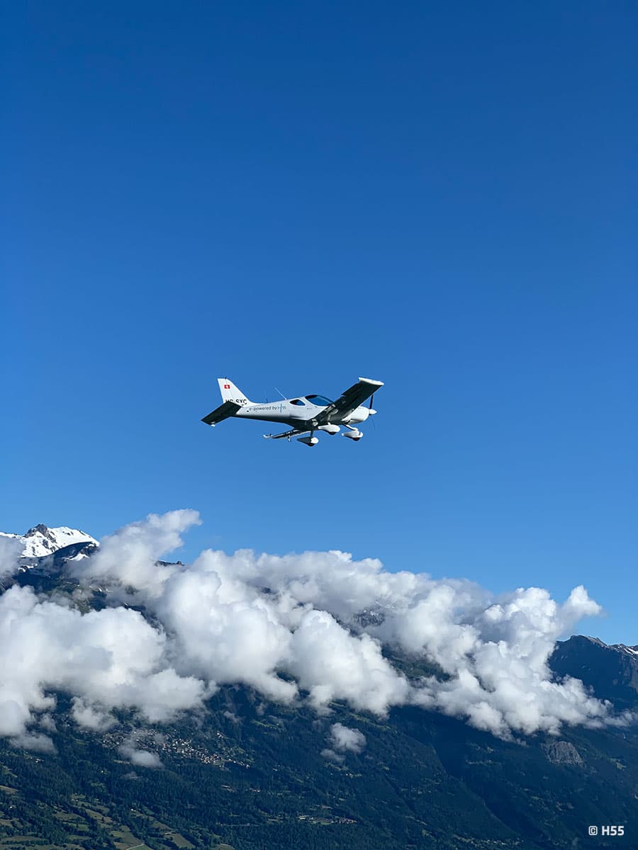 Bristell Energic banking above the Swiss landscape