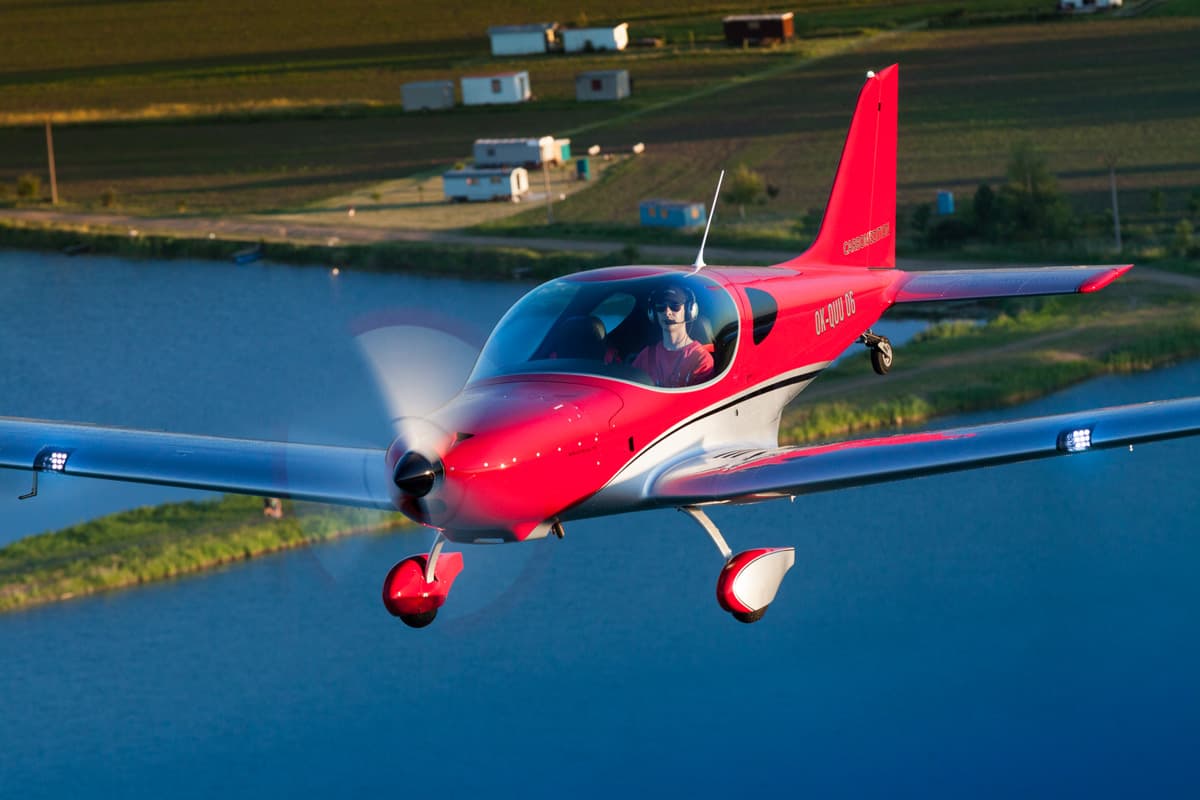 Bristell TDO front quarter over a lake
