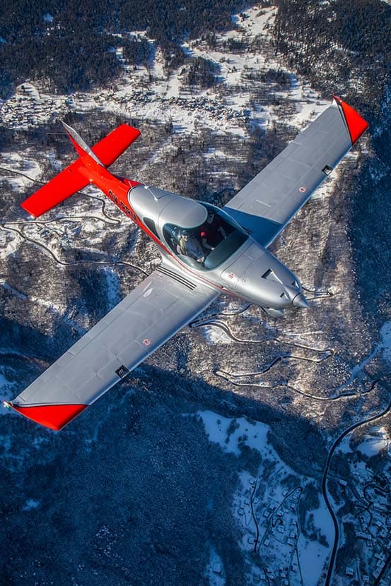 Bristell B23 Turbo flying high above snow-covered mountains