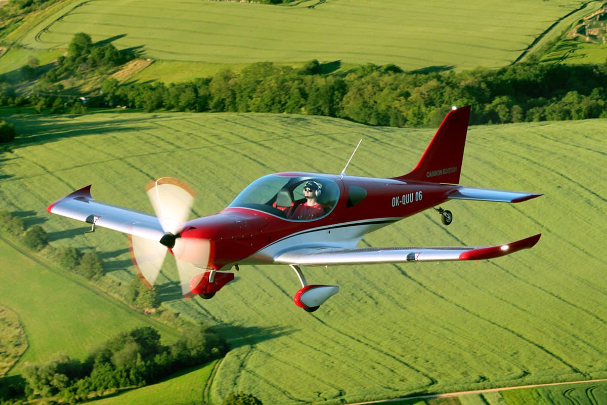 Bristell TDO with spinning propeller and tailwheel gear in flight